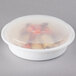 A Pactiv white plastic container with food inside.