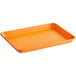 A Baker's Mark orange rectangular non-stick aluminum sheet pan with a wire in rim.