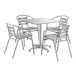 A Lancaster Table & Seating chrome square outdoor table with four silver arm chairs.