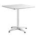 A Lancaster Table & Seating square white metal table with a metal base.