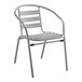 A gray metal chair with a white background.