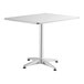 A white square Lancaster Table & Seating outdoor table with a metal base.