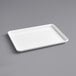 A white rectangular Baker's Mark tray with a wire rim on a gray background.
