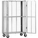 A white steel Vestil folding security truck with mesh sides and shelves.