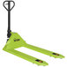 A green Vestil compact hand pallet truck with black handle and two wheels.