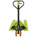 A green Vestil hand pallet truck with handle and wheels.