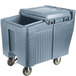 A grey Cambro mobile ice bin with wheels and a sliding lid.