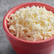 A bowl of V&V Supremo shredded Mexican 3-cheese blend.