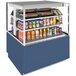 A Structural Concepts Reveal refrigerated display case with drinks and beverages on a counter.