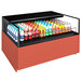 A Structural Concepts Reveal refrigerated self-service air curtain merchandiser with bottles of soda and soft drinks.
