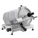 A silver Sirman manual gravity feed meat slicer with black handles.