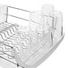 An OXO stainless steel dish rack with glasses and cups on it.
