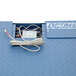 An Optima Weighing Systems cable in a blue metal box.