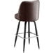 A brown vinyl bar stool with metal legs.