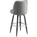 A Lancaster Table & Seating grey vinyl bar stool with black legs.