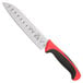 A Mercer Culinary Millennia Colors Santoku Knife with a red handle.