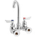 A silver Waterloo wall mount faucet with red and blue knobs.