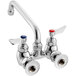A silver Waterloo wall-mounted faucet with red and blue knobs.