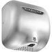 A stainless steel XLERATOR hand dryer with a black label.