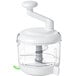 An OXO white food processor with a green handle.