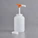 A white plastic jug with a white pump handle and an orange and white Pelican pump cap.