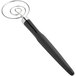 An OXO Good Grips black and silver whisk with a rubber handle.