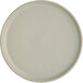 An Acopa Pangea white porcelain plate with a small rim.