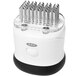 A white and black OXO Good Grips meat tenderizer with many metal tips.