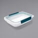 A white rectangular OXO food storage container with blue handles.