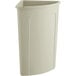 A beige plastic Lavex corner round trash can with a lid.