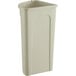 A beige plastic Lavex corner round trash can with a lid.