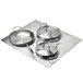 A Vollrath stainless steel adapter plate holding small and large casserole pans, and a saute pan.