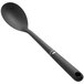 An OXO Good Grips black nylon spoon with a white handle.