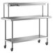 A stainless steel Regency work table with shelves on wheels.