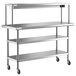 A stainless steel Regency expeditor table with shelves on wheels.
