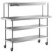 A stainless steel Regency work table with single overshelf and two undershelves on wheels.