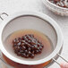 A sieve with Fanale U.S. Tapioca Boba Pearls in it.