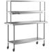 A stainless steel Regency work table with double shelves.