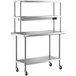 A silver stainless steel Regency expeditor table with double shelves on wheels.