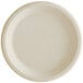 A white Tellus Products bagasse plate with a round surface and plain rim.