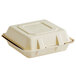 A white Tellus Products bagasse clamshell container with a lid.