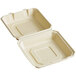 A white natural bagasse clamshell container with a hole in the middle.