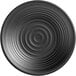 A close-up of an Acopa Izumi matte black melamine plate with a ripple pattern on it.