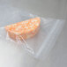A piece of cheese in an ARY VacMaster chamber vacuum packaging bag with a zipper.