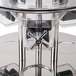 A stainless steel Tablecraft triple canister cereal dispenser with four spouts.