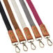 A close-up of Acopa Hazleton mocha leather straps with metal clasps.