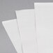 Choice white newsprint sandwich wrap paper. Three white sheets of newsprint sandwich wrap paper.