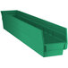 A green plastic Regency shelf bin with two compartments.