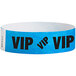 A blue paper wristband with black "VIP" text.