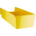 A yellow Regency plastic shelf bin.